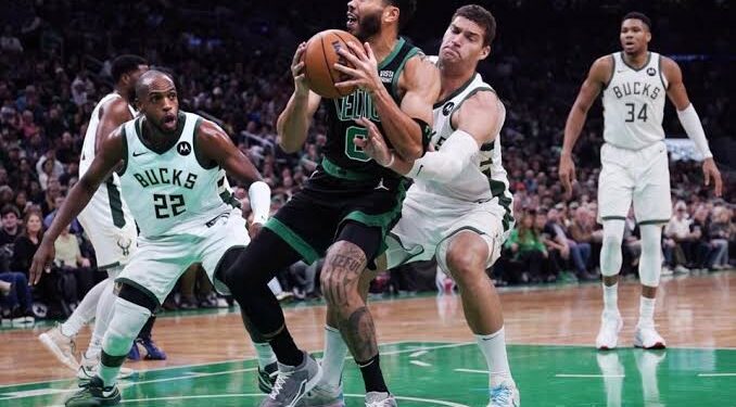 Tatum overcomes sickness, aids Celtics in slowing Giannis, and…