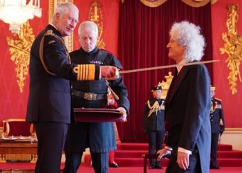 Knighted by Queen, Brian May makes light of the fact that his knees “just about” held…