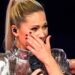 German pop artist Helene Fischer displays a gory face cut.