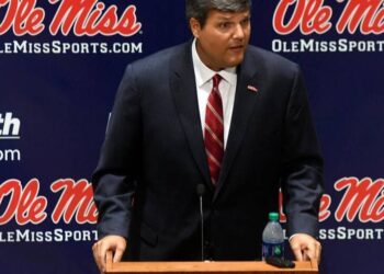 Matt Luke, the Ole Miss interim head coach, talks on Monday at a press conference in Oxford. Hugh Freeze is replaced by Luke, who…