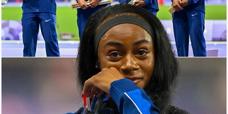 SHA ‘CARRI WAS EMOTIONAL ON THE PODIUM AFTER WINNING HER FIRST OLYMPIC GOLD   HER OLYMPIC REDEMPTION TOUR IS….