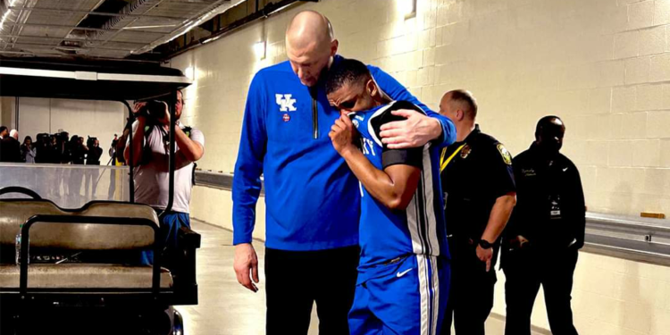 Mark Pope Consoles Lamont Bulter  Outside Locker Room following NCAA Tournament loss